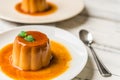 Close up of a flan creme caramel pudding with mint, a custard dessert. Royalty Free Stock Photo