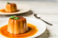 Close up of a flan creme caramel pudding with mint, a custard dessert. Royalty Free Stock Photo