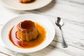 Close up of a flan creme caramel pudding with mint, a custard dessert. Royalty Free Stock Photo