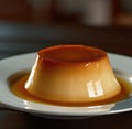 Close up of flan on white plate created using generative ai technology Royalty Free Stock Photo