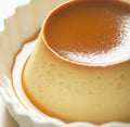 Close up of flan on white plate created using generative ai technology Royalty Free Stock Photo