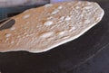 arabic bread called Markook in lebanon, being cooked on a convex iron plate. Royalty Free Stock Photo