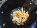 Top view, frying french fries using black pan Royalty Free Stock Photo