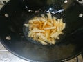 Top view, frying french fries using black pan Royalty Free Stock Photo