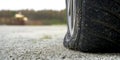 Close-up of Flat rear tire on car. The right rear broken weel. Damaged rear wheels on parking place Royalty Free Stock Photo