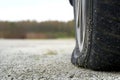 Close-up of Flat rear tire on car. The right rear broken weel. Damaged rear wheels on parking place Royalty Free Stock Photo