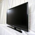 Close-up of a flat-screen TV against a white backdrop isolated on white background Royalty Free Stock Photo