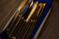Close up of flatware knives on wooden table Royalty Free Stock Photo