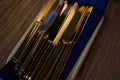 Close up of flatware knives on wooden table