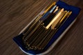 Close up of flatware knives on wooden table Royalty Free Stock Photo