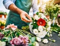 Close-up of florist hands making bouquet of flowers Royalty Free Stock Photo