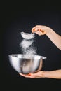 Flour sifting through a sieve for a baking