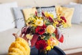 Close up of flower arrangement. Woman makes fall bouquet of sunflowers dahlias roses and zinnias in vase at home Royalty Free Stock Photo