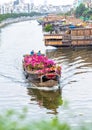 Close up flower boat on river suftwaves rays sunset