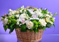 Close up flower bouquet arrangement in wicker basket  on white, carnation, rose, orchid, anunculus Royalty Free Stock Photo