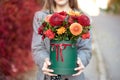 Close-up flower-box in woman hands as a gift concept for wedding, birthday, event, celebration, flowers delivery