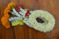 Close-up flowers, garland of Thailand, jasmine, roses placed on a wooden background