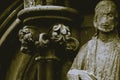 Close up of Flowers in Victorian Capital Column next to Damage S