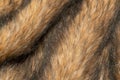 Close-up of a fluffy dark brown faux fur fabric with a background texture Royalty Free Stock Photo