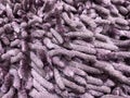 close up fluffy purple doormats or foot mat fabric texture. usually placed on the floor Royalty Free Stock Photo