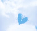 Fluffy white cloudy group with heart shaped patterns on bright blue sky for background Royalty Free Stock Photo