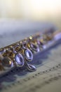 Close-up of a flute over a music sheet Royalty Free Stock Photo