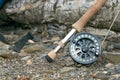 Close up of fly fishing rod and reel on riverbank