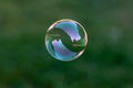 Close up of a transparent flying soap bubble Royalty Free Stock Photo