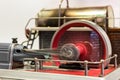 Close up of the flywheel of a steam engine