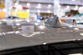 Close up of an FM AM GPS Navigation antenna placed on the roof of a vehicle.  Blurry defocused background Royalty Free Stock Photo