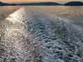 Close up of ocean water creating wakes and waves behind a ferry boat in the Pacific Ocean Royalty Free Stock Photo