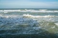 Foamy sea waves at shore in tropical beach in summer Royalty Free Stock Photo