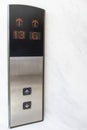 Close-up focus of the elevator up and down buttons and floor numbers Royalty Free Stock Photo