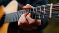 Close-Up Focus on Hand Playing Acoustic Guitar Strings in Natural Setting Royalty Free Stock Photo