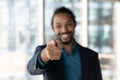 Close up African American hr manager pointing finger at camera