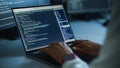 Close-up Focus on Person's Hands Typing on the Desktop Computer Keyboard. Screens Show Coding Royalty Free Stock Photo