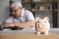 Close up focus on small pink piggybank, investment concept. Royalty Free Stock Photo