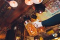 Close up focus view of man`s hand holding a big glass of draft beer in the pub. Royalty Free Stock Photo