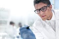 Close up.a focused scientist makes notes on the Board