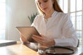 Close up focused woman doctor working on computer tablet Royalty Free Stock Photo