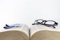 Close-up of folded reading glasses and a microfiber cloth Royalty Free Stock Photo