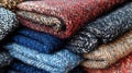 Close-up of Folded Wool Scarves with Intricate Patterns Royalty Free Stock Photo