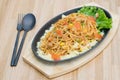 Close up food : Delicious Spaghetti with minced meat and vegetables. top view on wooden table with spoon and fork. Royalty Free Stock Photo