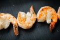 Close up food photo of fried shrimps on black slate background. Asian culture and cuisine. Food image of prawn for design of cafe,