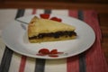 Close up food photography of traditional English homemade eccles tart made with currents and pastry on a table cloth background