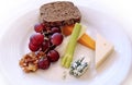 Artisan Cheese, Fruit and Nut Plate isolated on a white plate background