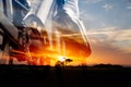 Close-up of the foot of a man cycling over field and orange sunset sky background Royalty Free Stock Photo