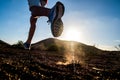 Close up of foot of man running alone in the mountains - active and fitness people lifesyle and concept - jogging and loss weight