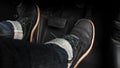 Close up foot press or push foot break and accelerate pedal of a car to drive ahead Royalty Free Stock Photo