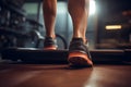 Close up foot sneakers Fitness girl running on track treadmill, muscular legs in exercise gym Royalty Free Stock Photo